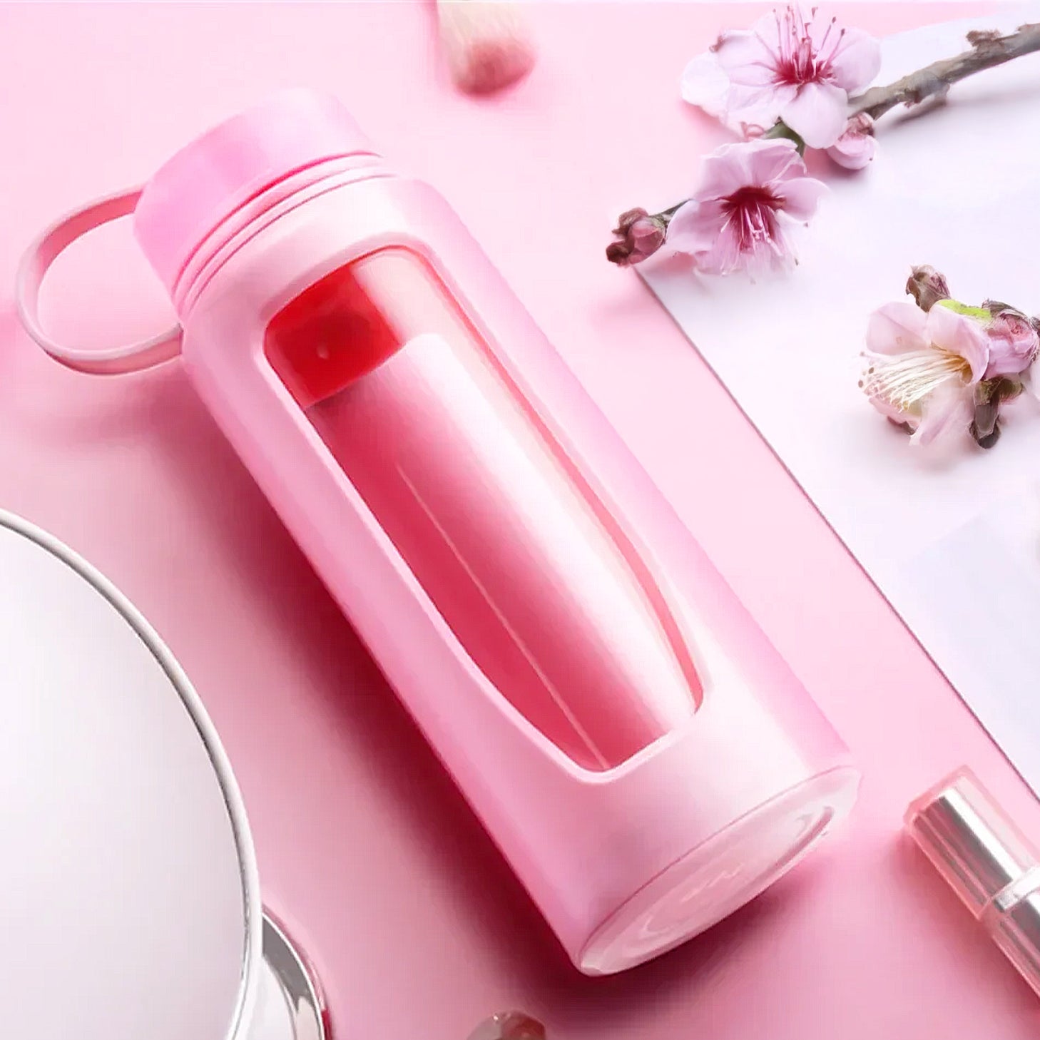 gourde en verre rose avec protection